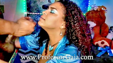 Professor GAIA seductively inhales toy near mouth in blue satin blouse, ebony beauty preview