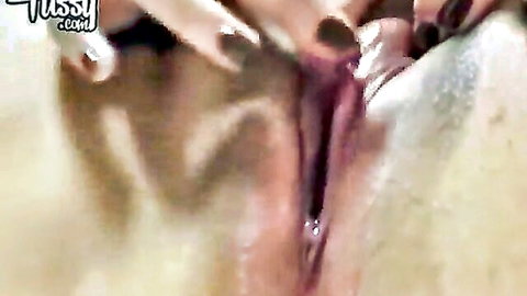 Close-up selfie of anonymous girl rubbing her big swollen clit