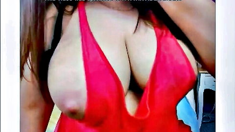 Busty brunette in tight red dress flaunting massive overflowing tits cleavage