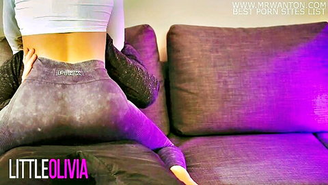 Fit babe in tight Lululemon yoga pants spreads big ass on couch grabbing cheek