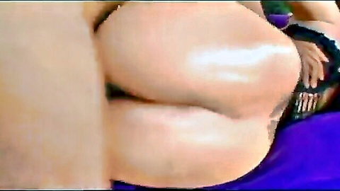Closeup of juicy thick white ass cheeks gripped by hand in purple lingerie