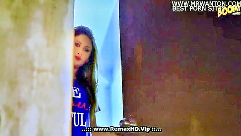 Indian woman peeking from door in tight blue t-shirt, teasing one night stand vibe