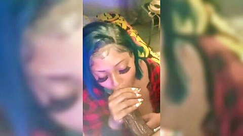 Ebony babe with blue hair deepthroats massive brown dildo in messy blowjob
