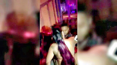 Curvy Latina dancer twerking in strip club neon lights