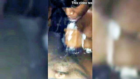 Ebony woman's messy cumshot facial with thick white load dripping from open mouth and chin