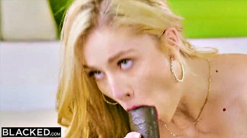 Blonde white girl addicted to BBC, sucking big black dildo close-up
