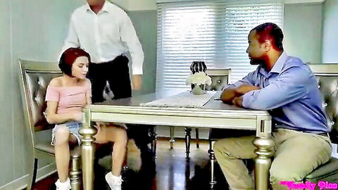 Redhead stepsister in short shorts spreads thighs teasingly between stepdad and black stud at family dinner table