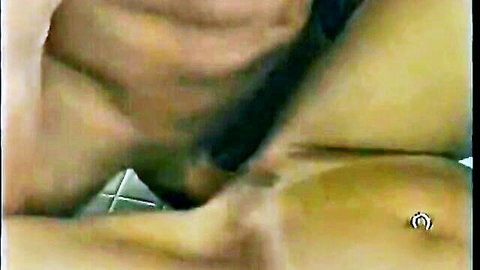 Peter North and Julie Rage intimate close-up with piercing