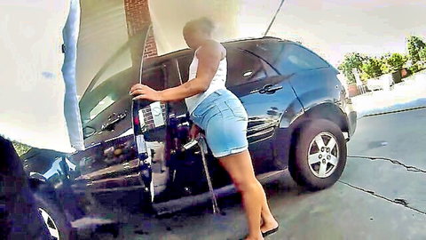 Petite black mom in tiny denim shorts bending over SUV showing perfect round ass