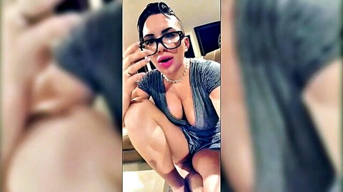 Busty MILF teacher in gray dress teases with deep cleavage and kissy face