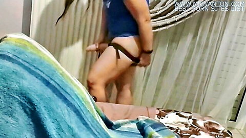 Thick-thighed MILF in strapon harness grips huge cock dildo ready to peg submissive