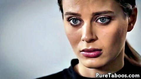 Lana Rhoades with intense blue eyes and serious expression in taboo scene