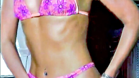 Manuela Iori in pink floral bikini, showing toned slim midriff