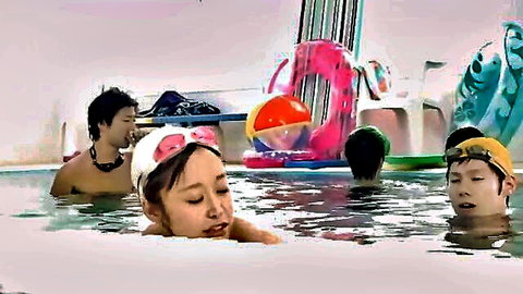 Asian MILF in swimsuit with young men at pool, mother-son incest theme