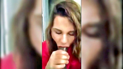 Fair-skinned brunette with long hair sucking thick black cock lips pursed closeup blowjob