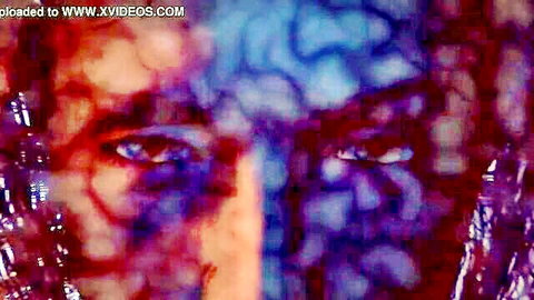 Intense blue-eyed woman in psychedelic fractal hentai closeup stare