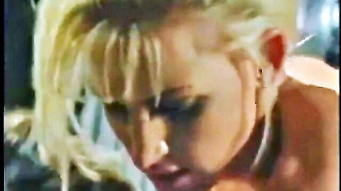 Blonde woman's ecstatic closeup face during intense blowjob pleasure