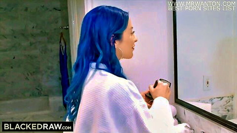 Jewelz Blu with long blue hair in white robe, seductive mirror pose