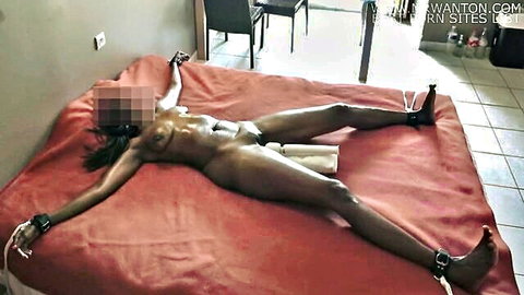 Oiled black woman tied up spread eagle in ecstasy, bound orgasm