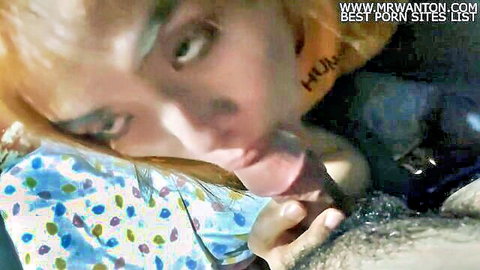 Redhead giving intense blowjob to photographer in amateur video