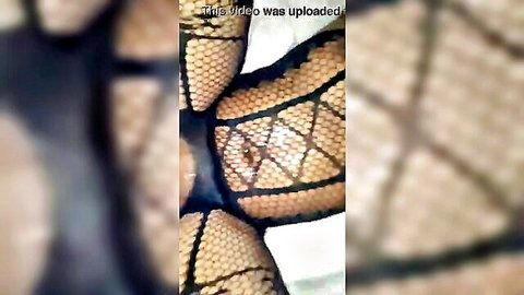 Close-up of babe's wet pussy in torn fishnets, intense squirting action