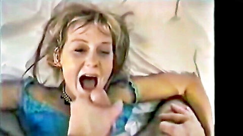 Blonde woman with mouth open wide, fingers inside, begging for facial cumshot