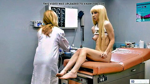 Blonde MILF doctor fingers petite young blonde's exposed pussy during medical exam