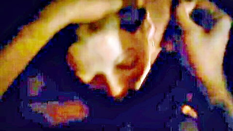 Blurry amateur close-up of woman's ecstatic face with wide eyes and open mouth during intense oral sex