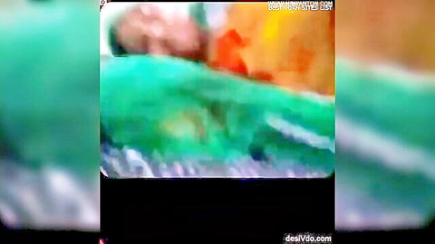 Blurry Asian woman sucks thick cock through gloryhole in green wall