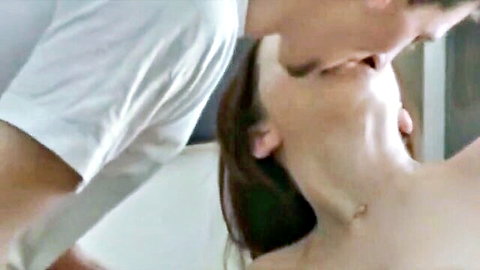 Close-up cumkiss between brunette woman and man, intense mouth exchange