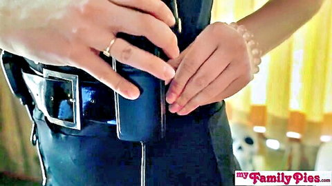 Asian step sister Momo in tight black dress adjusting belt holster, sexy hands closeup