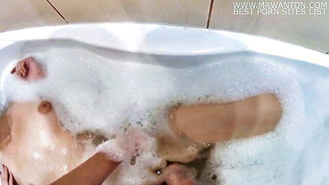 Russian girl in bubbly bath inserting anal plug, solo kink play