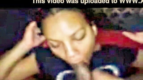 Ebony woman sucks thick black cock deep in her mouth during homemade blowjob