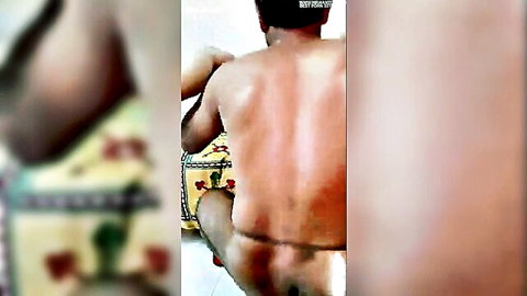Naked South Asian man bends over showing bare ass to woman on ornate bed