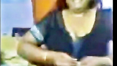 Vanaja Ramasamy Tamil aunty cleavage in low-cut black top