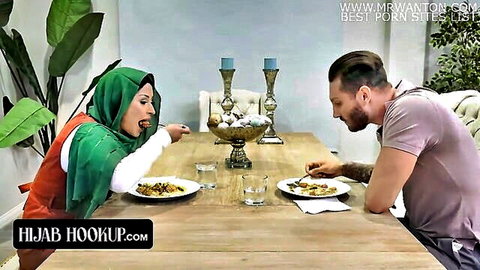Hijab babe seductively sticks out tongue at dinner table with muscular guy