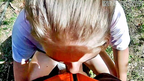 Blonde teen kneels in forest giving POV blowjob sucking hard cock