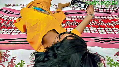 Indian beauty in yellow saree flashing blue panties selfie