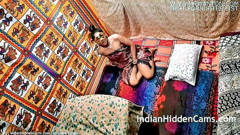 Seductive Indian bhabhi in black lace dress kneeling on bed