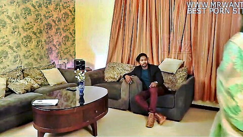 Dark-skinned man lounging on couch in hot stepmom sister threesome setup