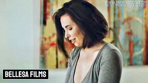 Casey Calvert smiling in gray v-neck top showing cleavage, Bellesa Films