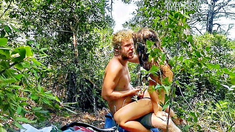 Passionate teen couple in romantic jungle sex embrace, outdoor bliss