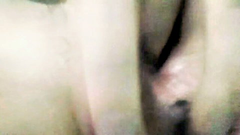 Blurry closeup of spread pink pussy lips and wet vulva in solo tease