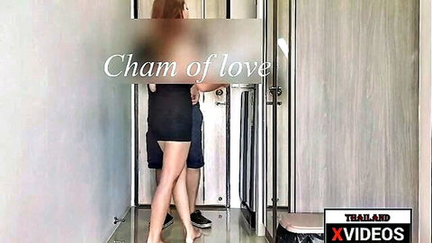 Thai babe in short black dress tempts guy in dorm hallway