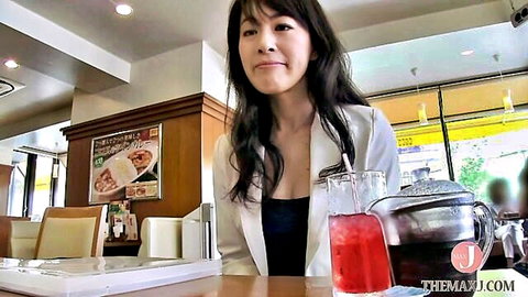 Smiling Japanese woman in white blazer and black top with drinks, GRAPHIS JAV thumbnail