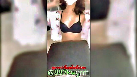 Asian woman in black bra and open robe stripping live on cam
