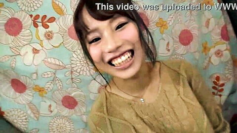 Cute smiling Japanese amateur babe in sweater against floral background
