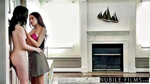 Skinny tanned lesbians in lingerie embrace with hairy pussy exposed against wall