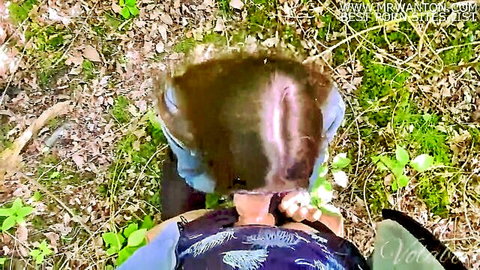 Brunette in blue dress bent over in woods bushes, outdoor POV quickie tease