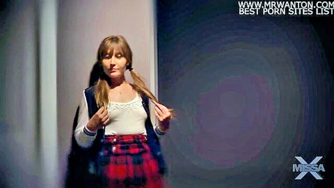 Skinny brunette schoolgirl with pigtails in lace top and plaid skirt teases in hallway